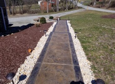 Concrete walkway with landscaping