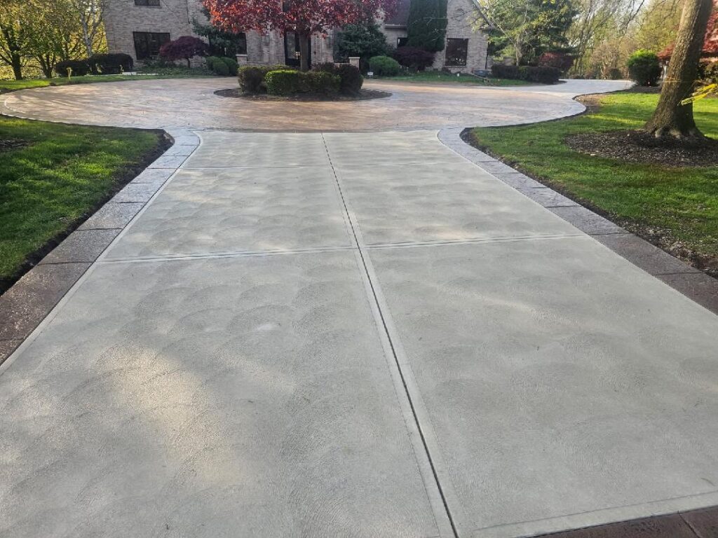 Stamped concrete governor's circle driveway with stamped borders in Gibsonia, PA.