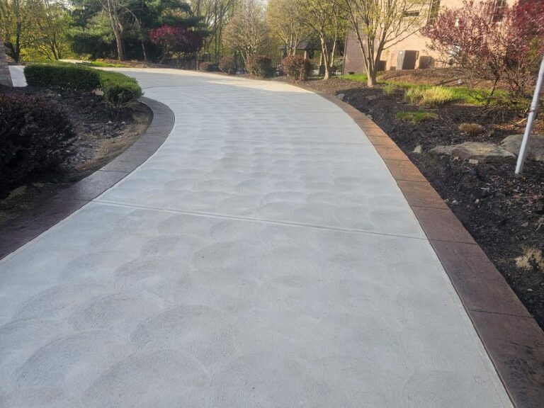 Swirl concrete driveway with stamped borders