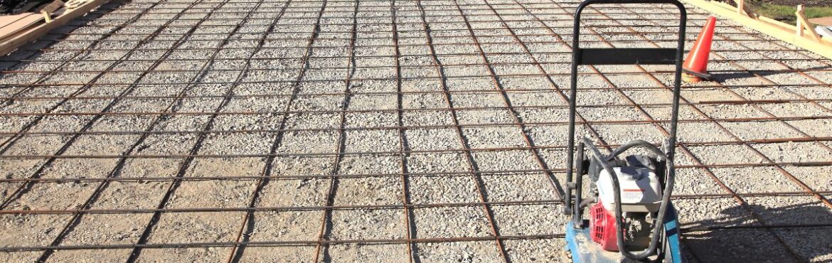 Active driveway construction site with machinery