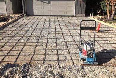 Active driveway construction site with machinery