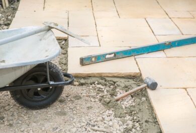 Ongoing patio build with construction tools
