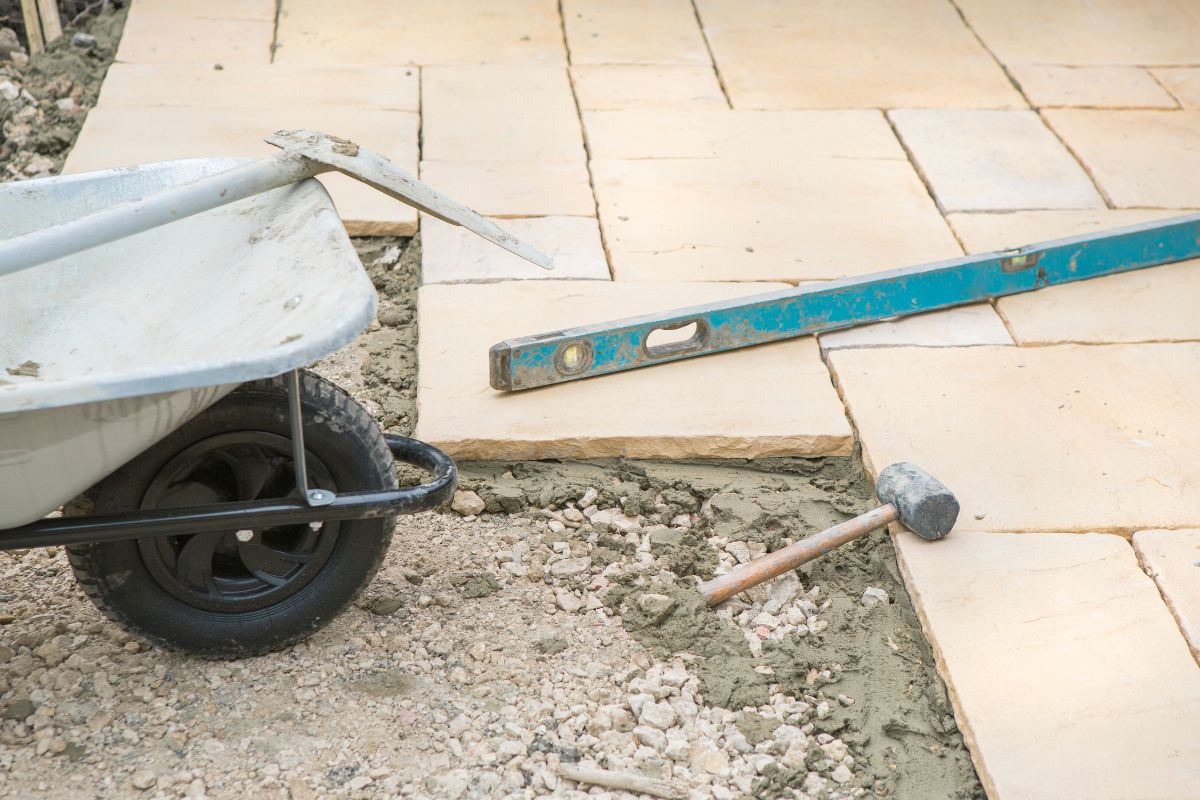 Ongoing patio build with construction tools