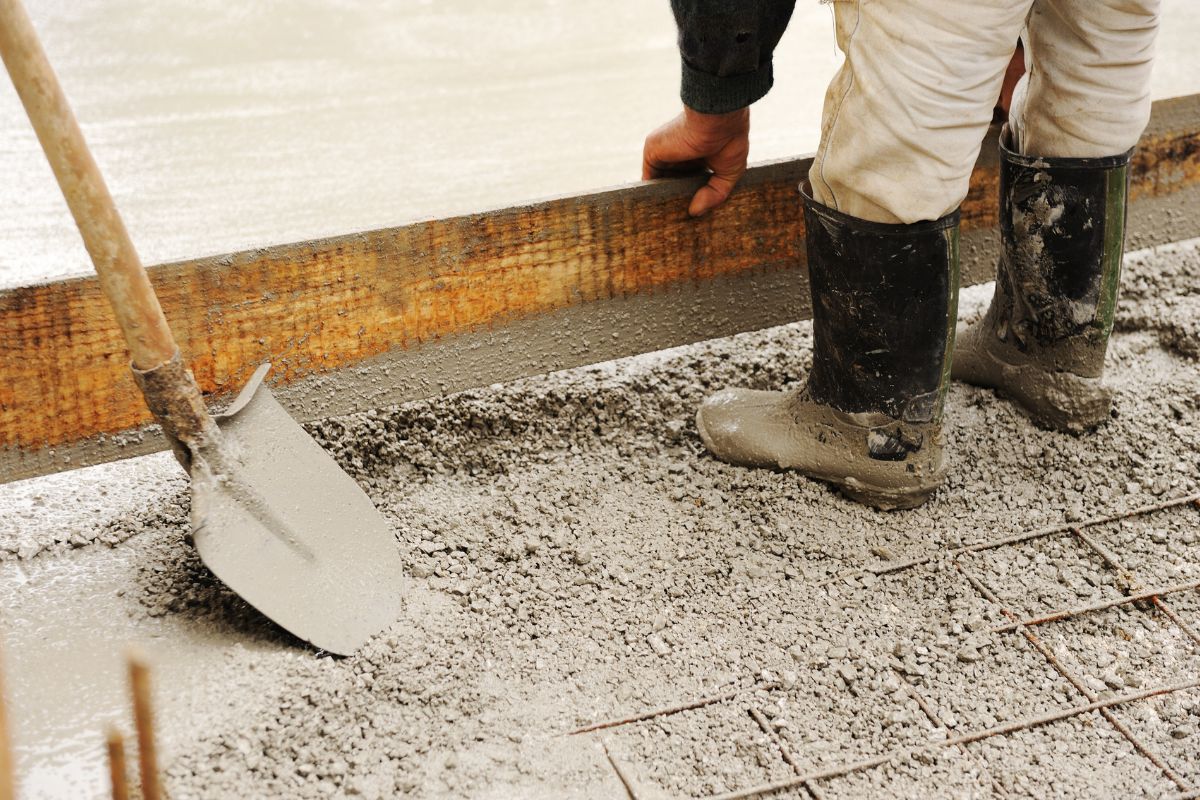 Workers completing ongoing concrete structure build