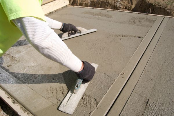 Commercial sidewalk construction workers improving pathway