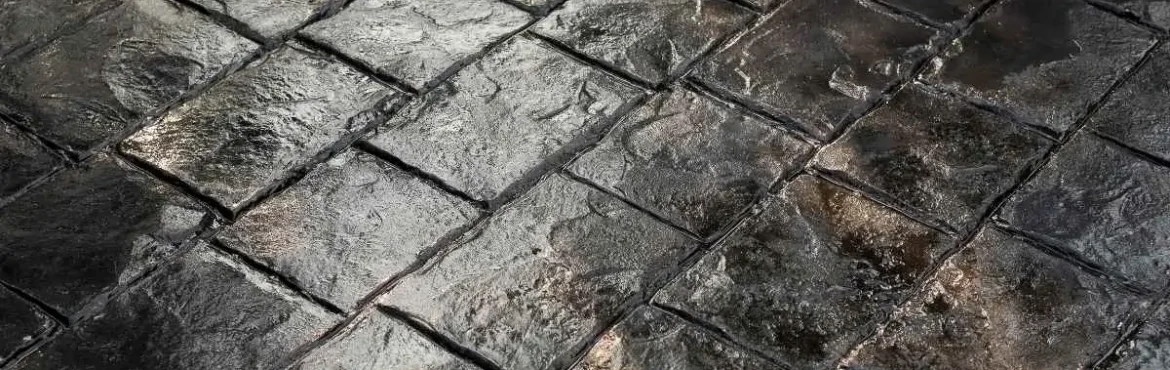Stamped concrete driveway in a residential front yard.