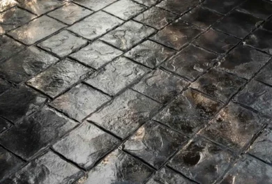 Stamped concrete driveway in a residential front yard.