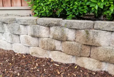 Stone retaining wall in garden landscape