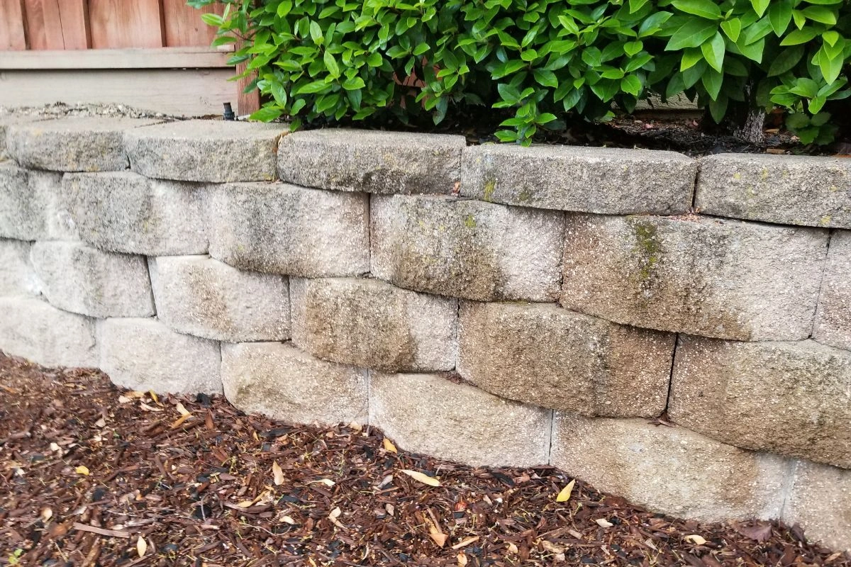 Stone retaining wall in garden landscape