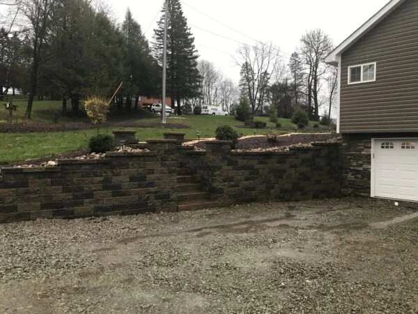 Retaining walls lining a residential driveway.