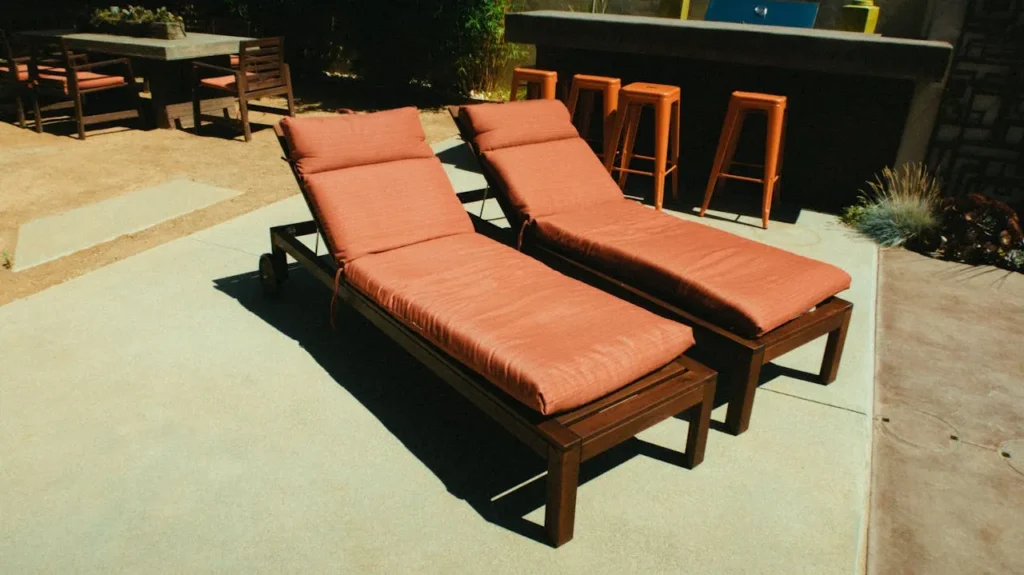 Lounge chairs resting on a concrete patio