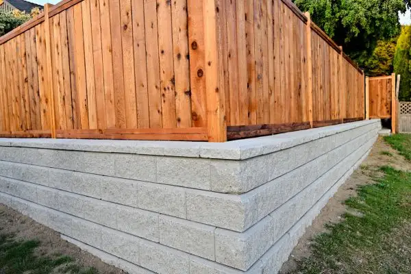 Retaining walls with attached fence